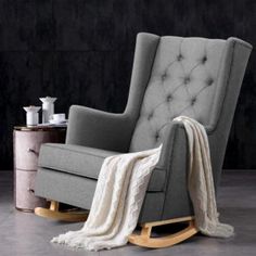 a rocking chair with a blanket on it