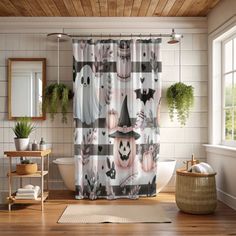 a bathroom decorated in halloween themed decor with pumpkins and witches on the shower curtain