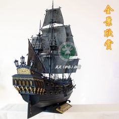 a model ship is shown on a white surface with chinese characters in the back ground