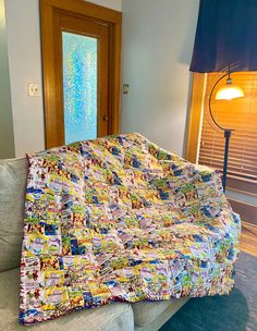 a couch with a quilt on top of it