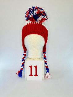 #1 LET'S GO BUFFALO!  Looking to level up your tailgating swag??? This is a one of a kind handmade (crochet) Buffalo football mohawk winter hat! It is made with doubled thick yarn to keep you warm from the pregame tailgate through the post-game VICTORY party! These hats are super cozy to protect you from the whipping winds and cold temps all football season.  Each hat is slightly different because they are all handmade. Each hat is made close to 22 inches in diameter around the largest part of my forehead. The band is crocheted to have some give to it, like elastic to allow each hat to fit multiple head sizes.    Please note these are custom made and I only have the number listed in stock. This hat is made with Red Glitter yarn. Crochet Buffalo, Buffalo Football, Crochet Unique, Thick Yarn, Red Glitter, Football Season, Winter Hat, Handmade Crochet, Victorious