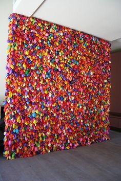 the wall is covered with colorful confetti