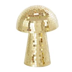 a shiny gold mushroom shaped object on a white background