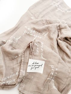 the label is on an unbuttoned piece of cloth that has been folded