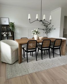 a dining room table with chairs around it