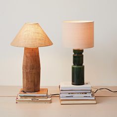 a lamp and some books on a table