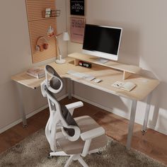 a computer desk with a monitor, keyboard and mouse on it next to a chair