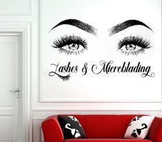 an eye with lashes and eyelashes wall decal on the wall in a living room