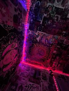 a room with many pictures and lights on the walls