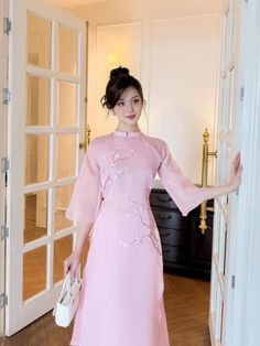 At EmTam Boutique, you will find the most stylish outfits in a wide size range and high quality at reasonable prices   - This set includes 1 ao dai top & pants, perfect for any special occasions like lunar New year, mid-autumn festival, wedding, temple, church or photoshoot...  - There might be up to 10% color variance due to lightning and viewing devices   - Sizes may run small so please go up 1 size or contact us if there's   any question. Please refer to the sizing charts for sizing.  - We su Summer Traditional Ao Dai For Parties, Traditional Ao Dai For Summer Party, Summer Party Traditional Ao Dai, Pink Summer Wedding Cheongsam, Spring Fitted Sets With Stand Collar, Fitted Spring Sets With Stand Collar, Summer Wedding Pink Cheongsam, Pink Cheongsam For Spring Party, Elegant Pink Short Sleeve Sets