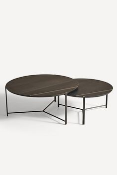 two coffee tables sitting on top of each other