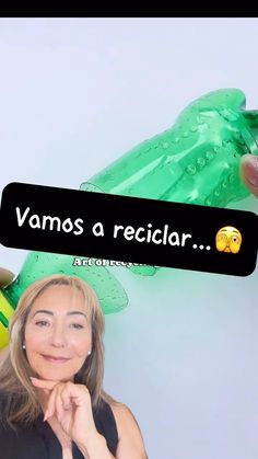 a woman standing in front of a green plastic frog with the caption vamos a reciclar