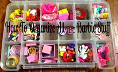 a plastic container filled with lots of crafting supplies on top of a wooden table