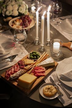 a table is set with food and candles