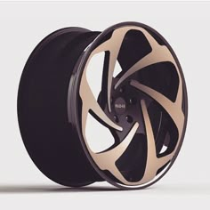 an image of a wheel that is black and gold