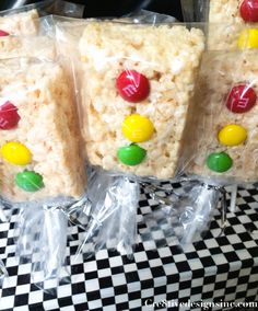 two bags of rice krispy treats on top of a checkered table