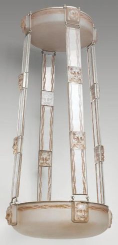 an art deco chandelier with frosted glass panels