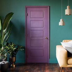 A purple five-panel interior door in a turquoise room with a yellow ceiling and wood floors Spruce Up Your Home