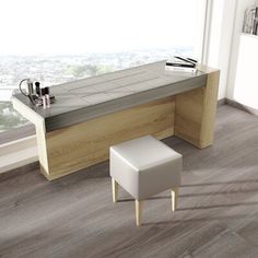 an office desk with a bench and stool in front of a window overlooking the city