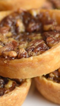 several pecan pies stacked on top of each other with nuts in the middle