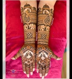 two hands that are decorated with henna and designs on them, one is holding the other