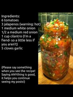 a jar filled with food sitting on top of a wooden table