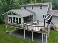 an aerial view of a house with deck and patio