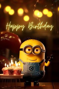 a minion holding a birthday cake with candles on it and the words happy birthday written in