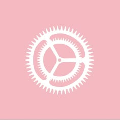 a pink background with an image of a gear wheel on the bottom right hand corner