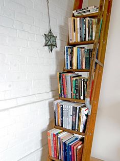 there is a ladder that has books on it