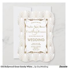 an elegant wedding card with gold foil on the front and white paper in the back