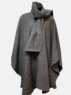 Heavyweight wool blend classic wrap with detached signature matching scarf. Dry clean Elegant Oversized Wool Poncho, Oversized Cashmere Wraps For Winter, Elegant Merino Wool Scarves For Fall, Elegant Merino Wool Scarf For Fall, Cashmere Wrap For Winter, Classic Wool Cape For Fall, Classic Wool Scarves For Fall, Elegant Wool Shawl Outerwear, Winter Cashmere Wrap Outerwear