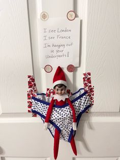 an elf is hanging on the front door