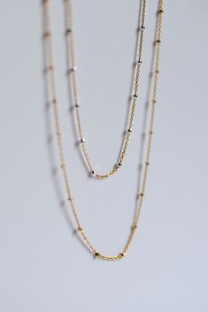 The Mixed Metal Satellite Chain is our bestselling chain featuring Sterling Silver faceted metal beads between each gold length of cable chain. Made in tarnish-resistant 14K Gold-Fill + Sterling Silver materials with sustainability in mind. Style Tip - Order the 14” length to double your chain as a choker necklace or a wrap-around Bracelet! Product Highlights: Available in Multiple Lengths Shorter lengths can double as a Bracelet or a Necklace Lobster Clasp End Fastening Made in 14KY Gold Fill + Double Strand Satellite Chain Necklace As Gift, Gift Satellite Chain Double Strand Necklace, Everyday Double Strand Satellite Chain Necklace, Gold Chain Necklace With Beaded Chain For Layering, Gold Beaded Chain Necklace For Layering, Everyday Double Strand Beaded Chain Necklace, 14k Gold-filled Cable Chain Necklace For Layering, Yellow Gold Satellite Chain Necklace For Layering, Mixed Metal Necklace