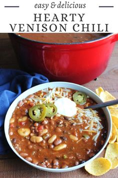 a bowl of hearty venison chili with tortilla chips on the side