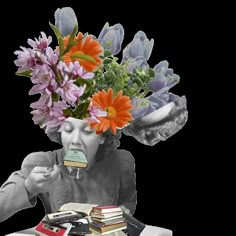 a woman sitting at a table with books and flowers in her head