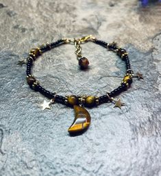 Celestial moon and star crystal anklet with tigers eye and extender ✨ Crystal Bracelet Ideas, Knitting Moodboard, Grunge Diy, Tigers Eye Crystal, Bracelet Rings, Anklet Gold, Handmade Anklets, Grunge Accessories, Star Crystal