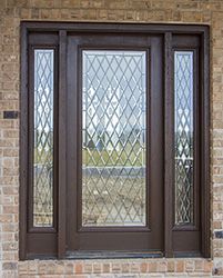 a close up of a glass door on a brick building