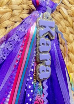 there is a purple ribbon with the word rappop on it next to some other ribbons