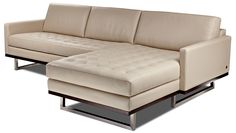 a brown leather couch sitting on top of a metal frame