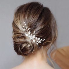 a woman wearing a bridal hair comb