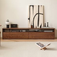 a living room scene with focus on the entertainment center and coffee table in the foreground