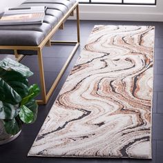 a large rug in the middle of a living room with a bench and window behind it