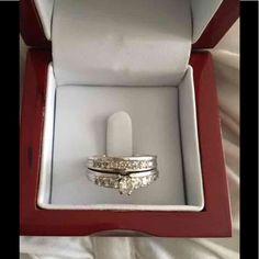 two wedding rings in a red box