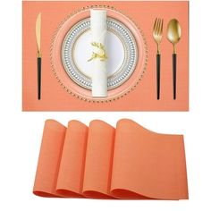 a place setting with napkins, silverware and gold - plated utensils