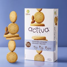 a box of activa biscuits stacked on top of each other with almonds in the middle