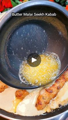 a pan filled with food and sauce on top of a table