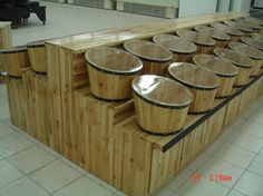 several wooden buckets stacked on top of each other