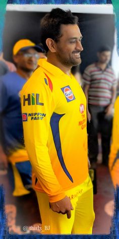 a man in yellow jersey standing next to other men