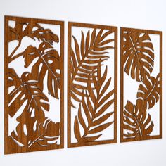 three pieces of wood cut out to look like leaves